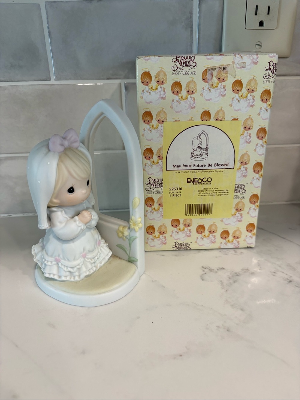 Enesco Precious Moments Figurine in White and Pastel Yellow